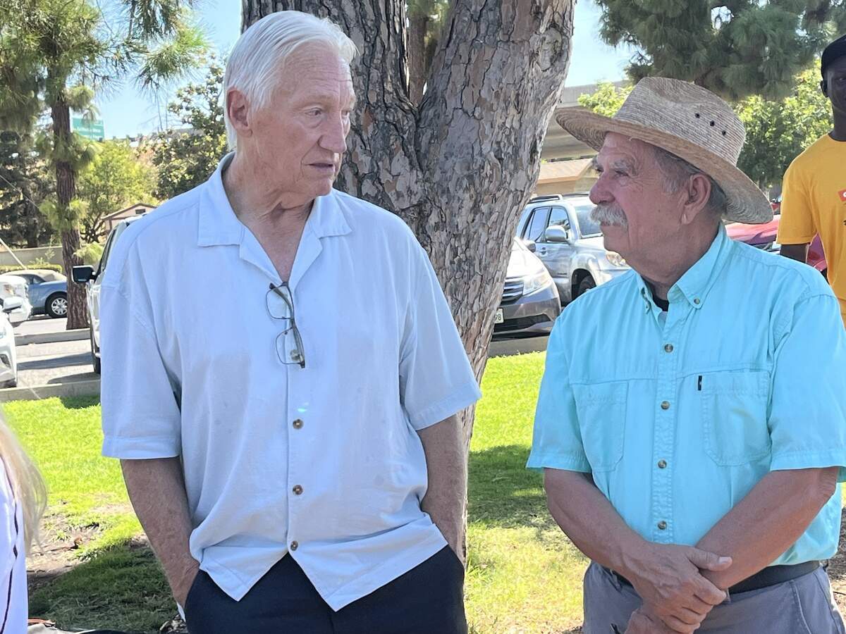 Former Fresno Mayor Alan Autry, left, talks with former state Assemblyman Juan Arambula, at the Yes on Measure S campaign kickoff at Vinland Park in Fresno on Sept. 9, 2026.